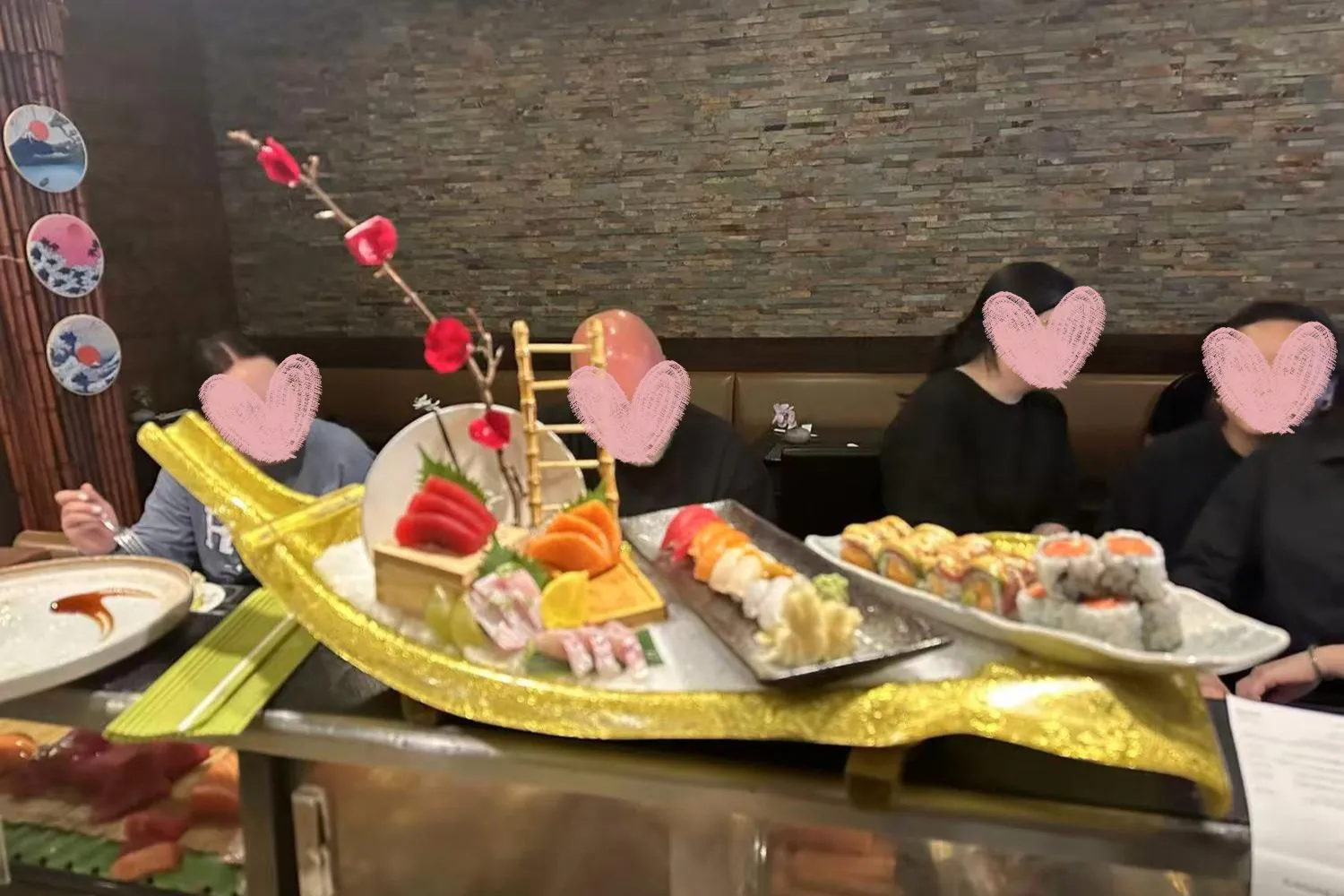Golden boat-shaped sushi and sashimi platter at Kumo Japanese Cuisine Restaurant in Depew